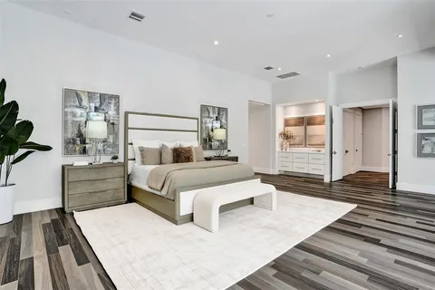 a spacious bathroom with double vanity and a mirror