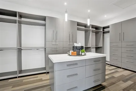 a kitchen with stainless steel appliances a sink and cabinets