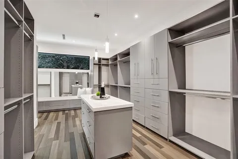 a kitchen with kitchen island a sink stove and refrigerator