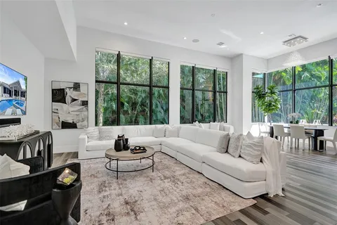 a view of a patio with couches and a potted plant