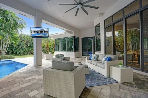a kitchen with a sink a stove and cabinets