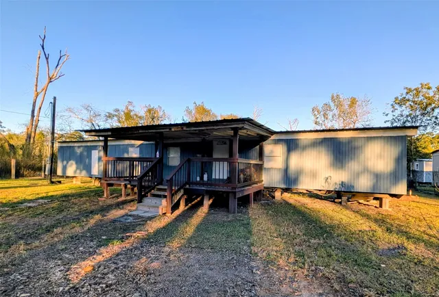 a view of a backyard with chairs