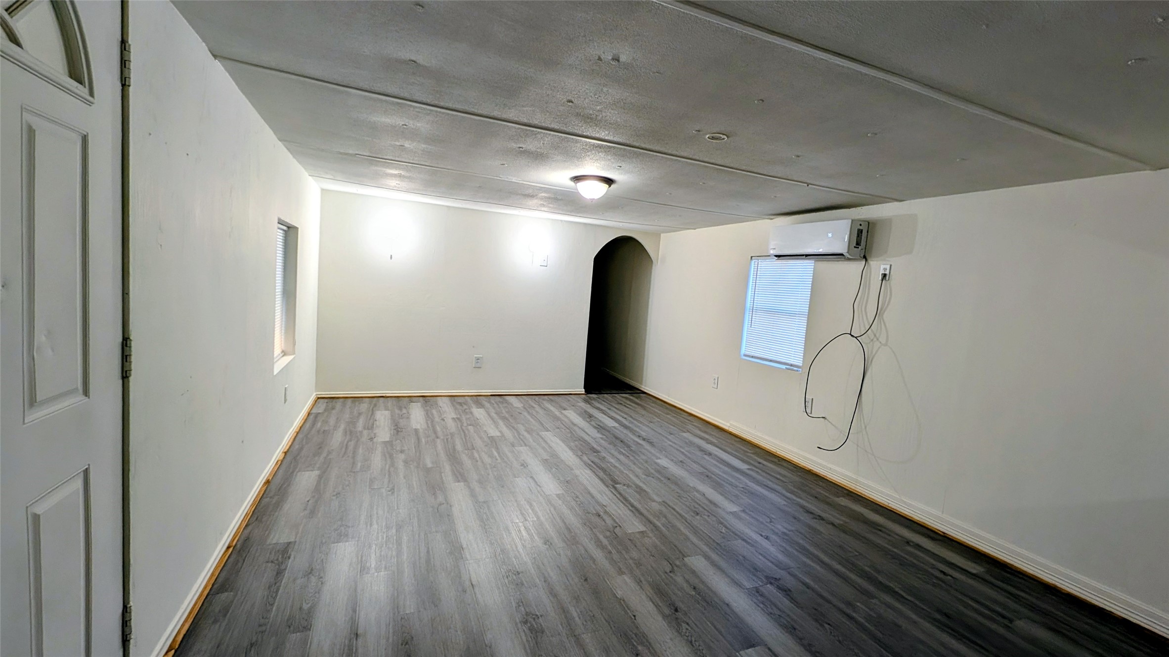 6621 West Forest Road Conroe, TX 77306 - Photo 4 of 10 a view of empty room with wooden floor