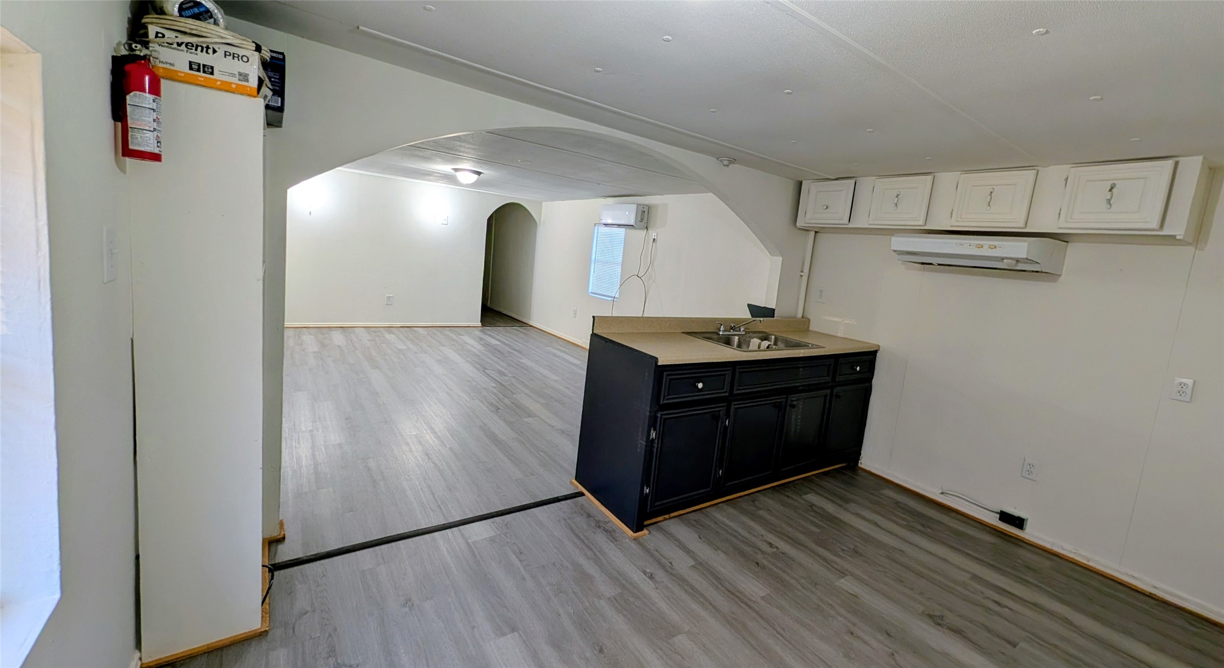 6621 West Forest Road Conroe, TX 77306 - Photo 5 of 10 a kitchen with stainless steel appliances granite countertop a sink and a refrigerator