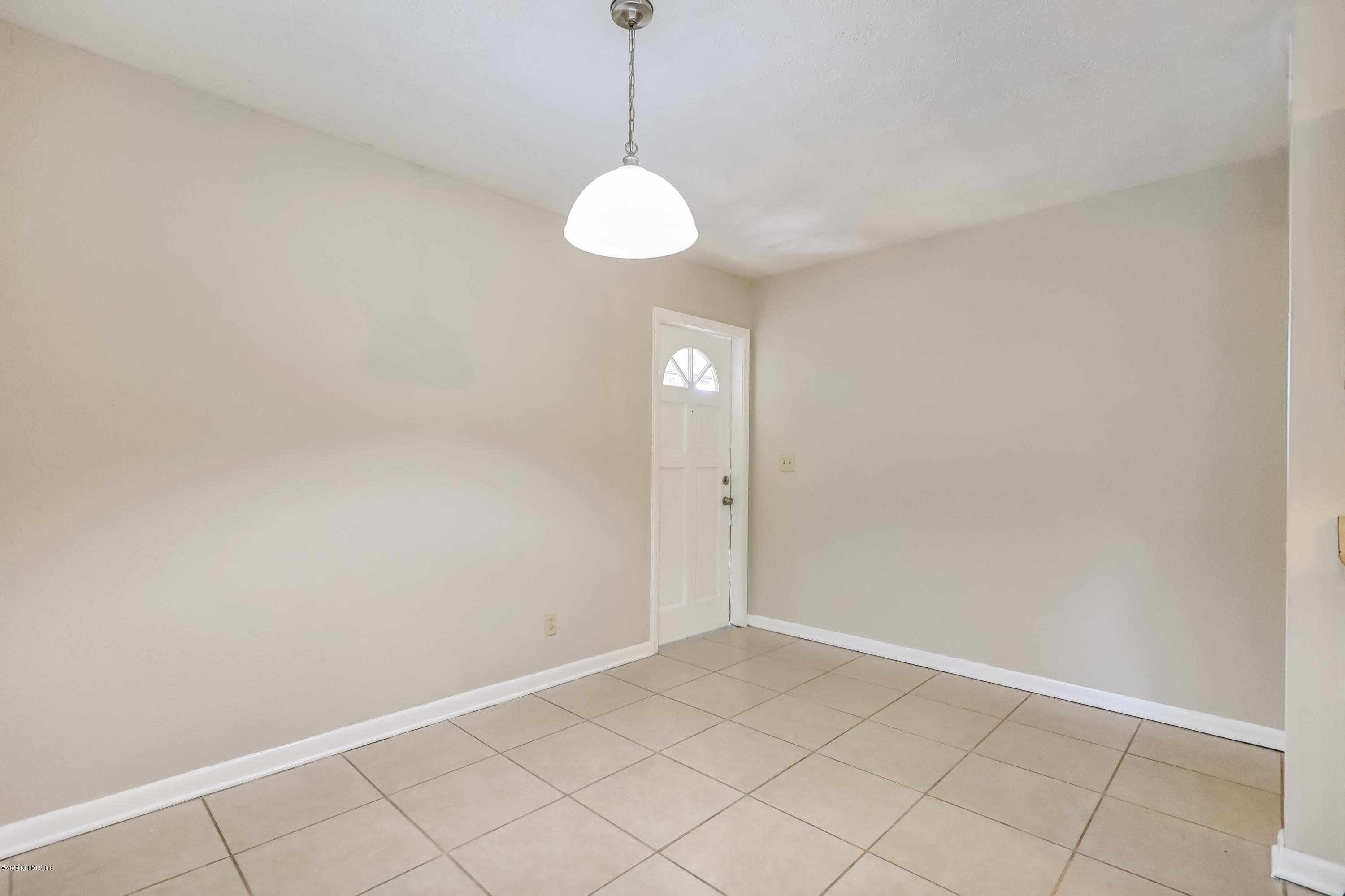 4427 Barnes Road South Jacksonville, FL 32207 - Photo 15 of 39 a view of an empty room with a window