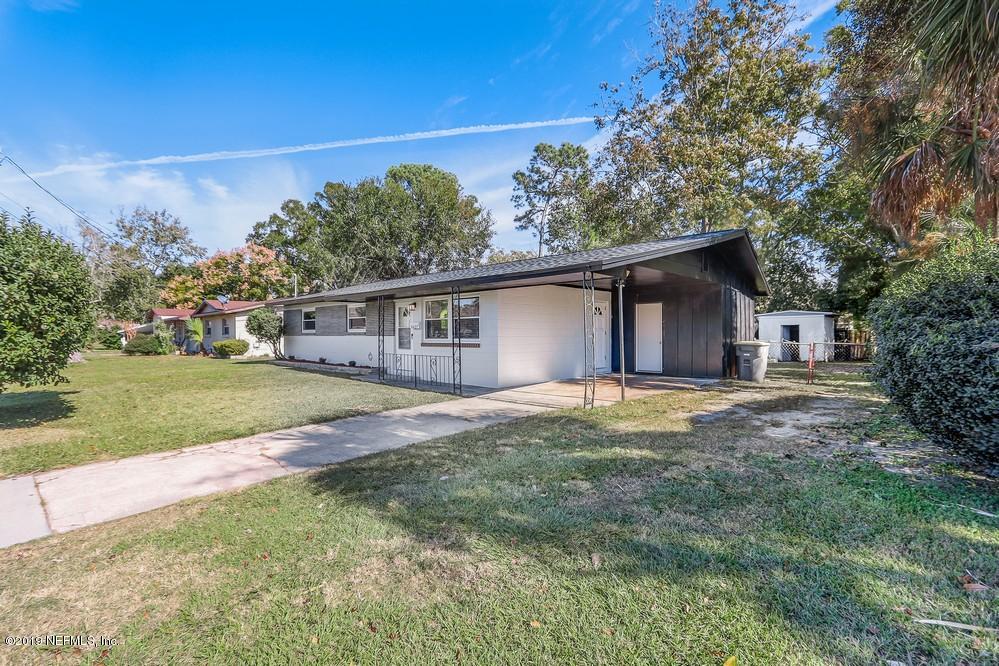 4427 Barnes Road South Jacksonville, FL 32207 - Photo 2 of 39 a view of a house with backyard and trees