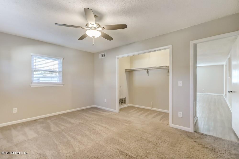 4427 Barnes Road South Jacksonville, FL 32207 - Photo 22 of 39 a view of an empty room with a window