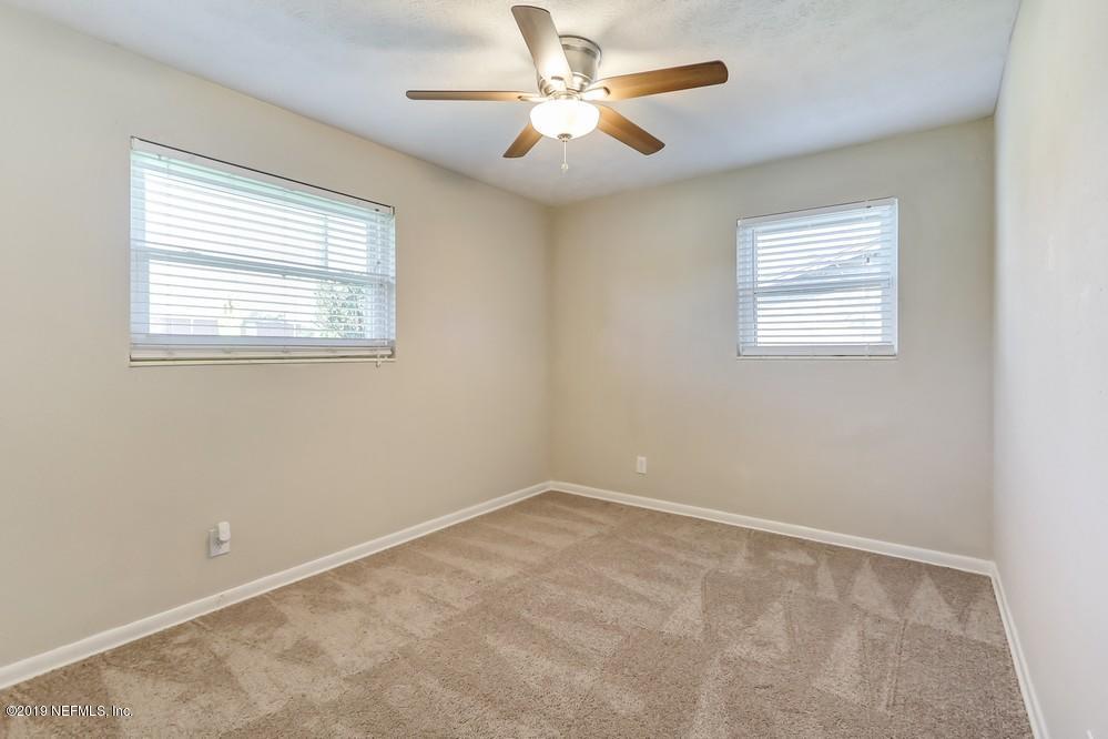 4427 Barnes Road South Jacksonville, FL 32207 - Photo 31 of 39 a view of an empty room with a window