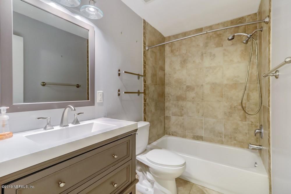4427 Barnes Road South Jacksonville, FL 32207 - Photo 34 of 39 a bathroom with a sink mirror toilet and bathtub