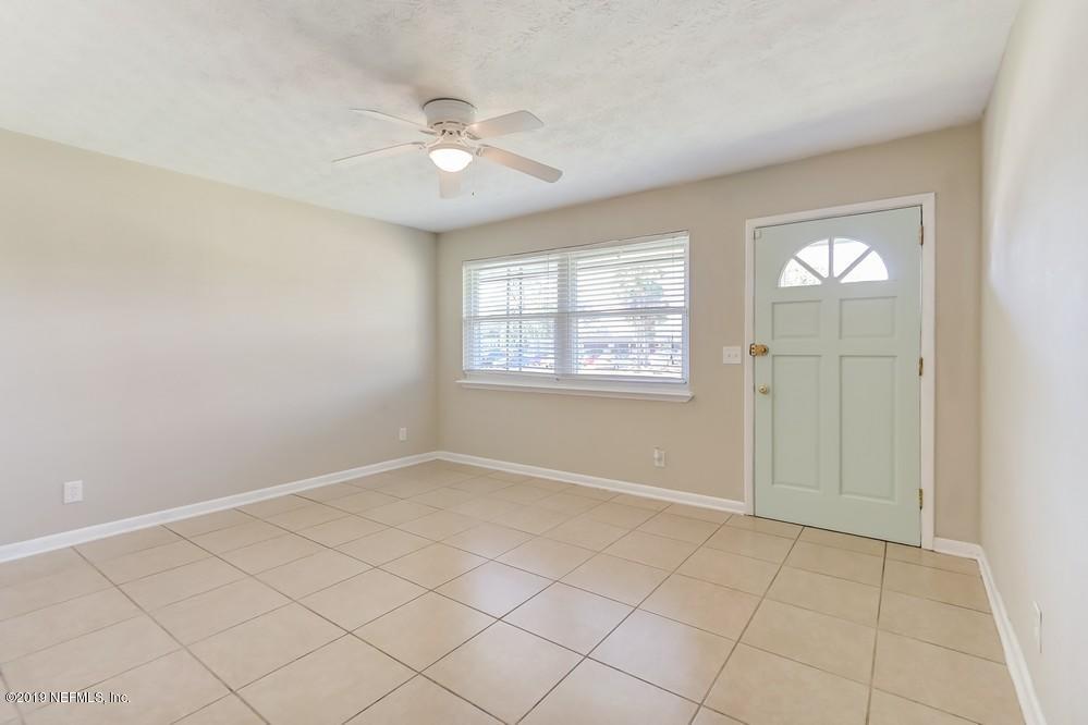 4427 Barnes Road South Jacksonville, FL 32207 - Photo 9 of 39 a view of an empty room with a window