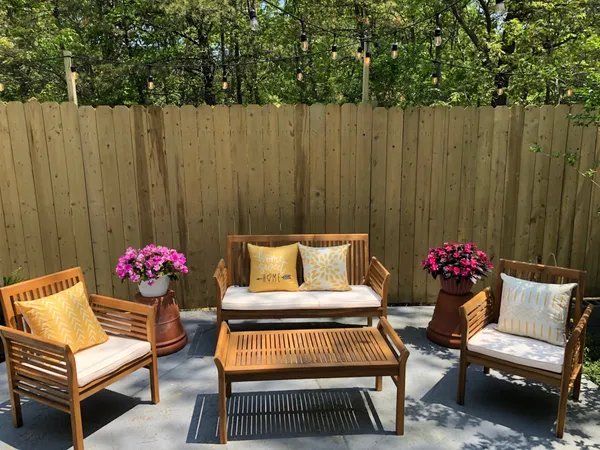 a outdoor living space with furniture and a potted plant