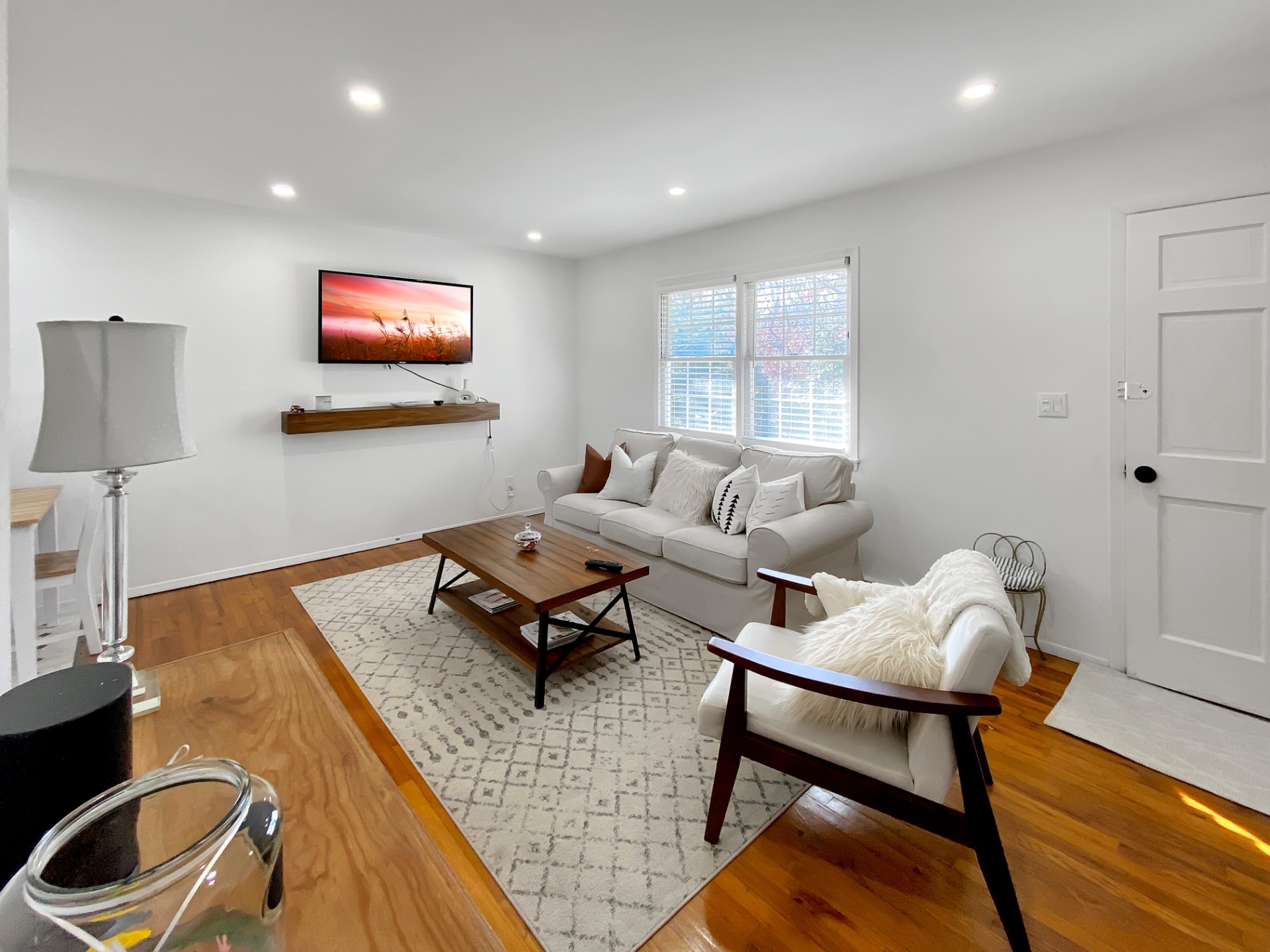18 Old Riverhead Road East Hampton Bays, NY 11946 - Photo 2 of 15 a living room with furniture and a flat screen tv