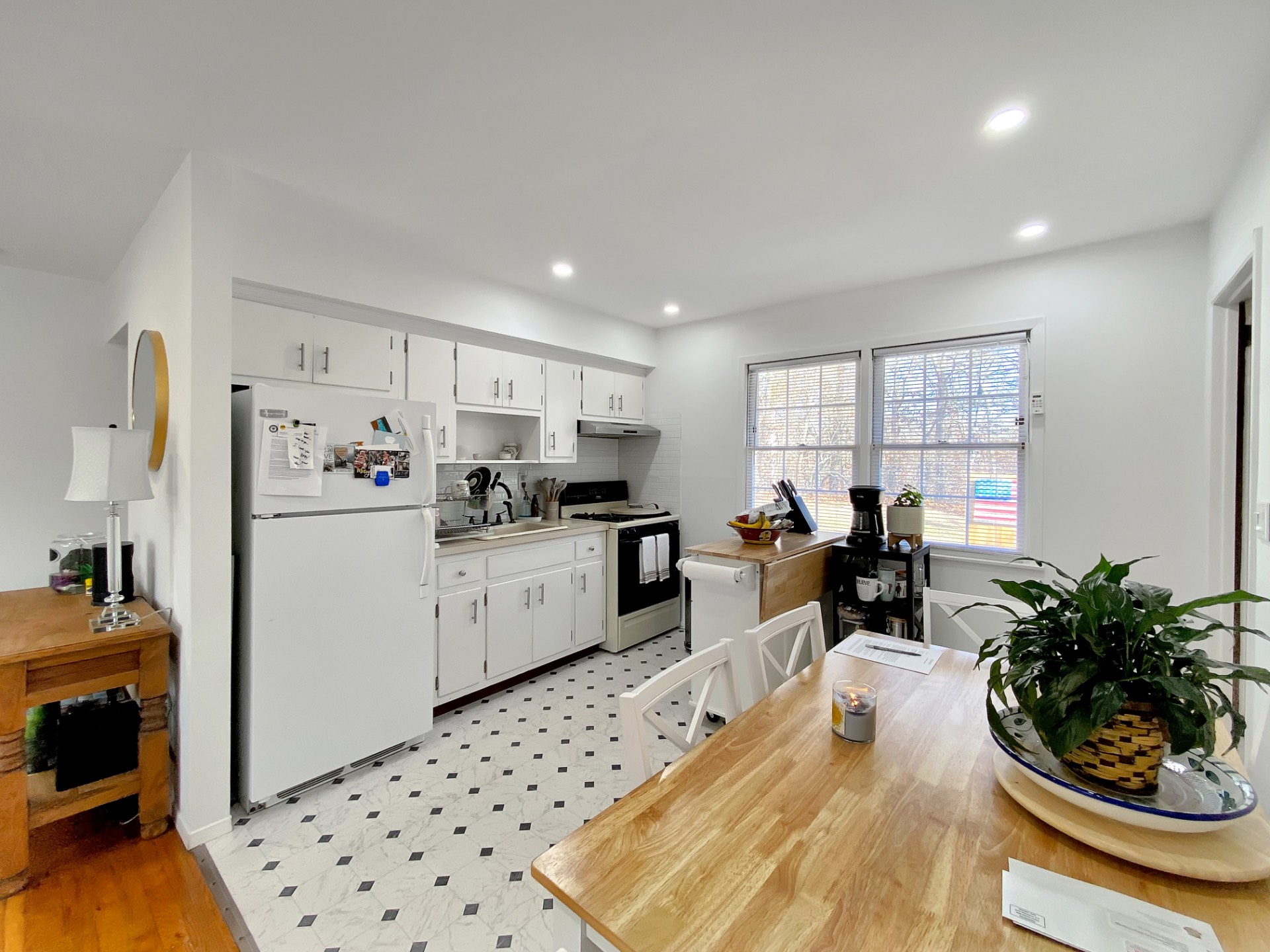 18 Old Riverhead Road East Hampton Bays, NY 11946 - Photo 4 of 15 a kitchen with sink refrigerator and window