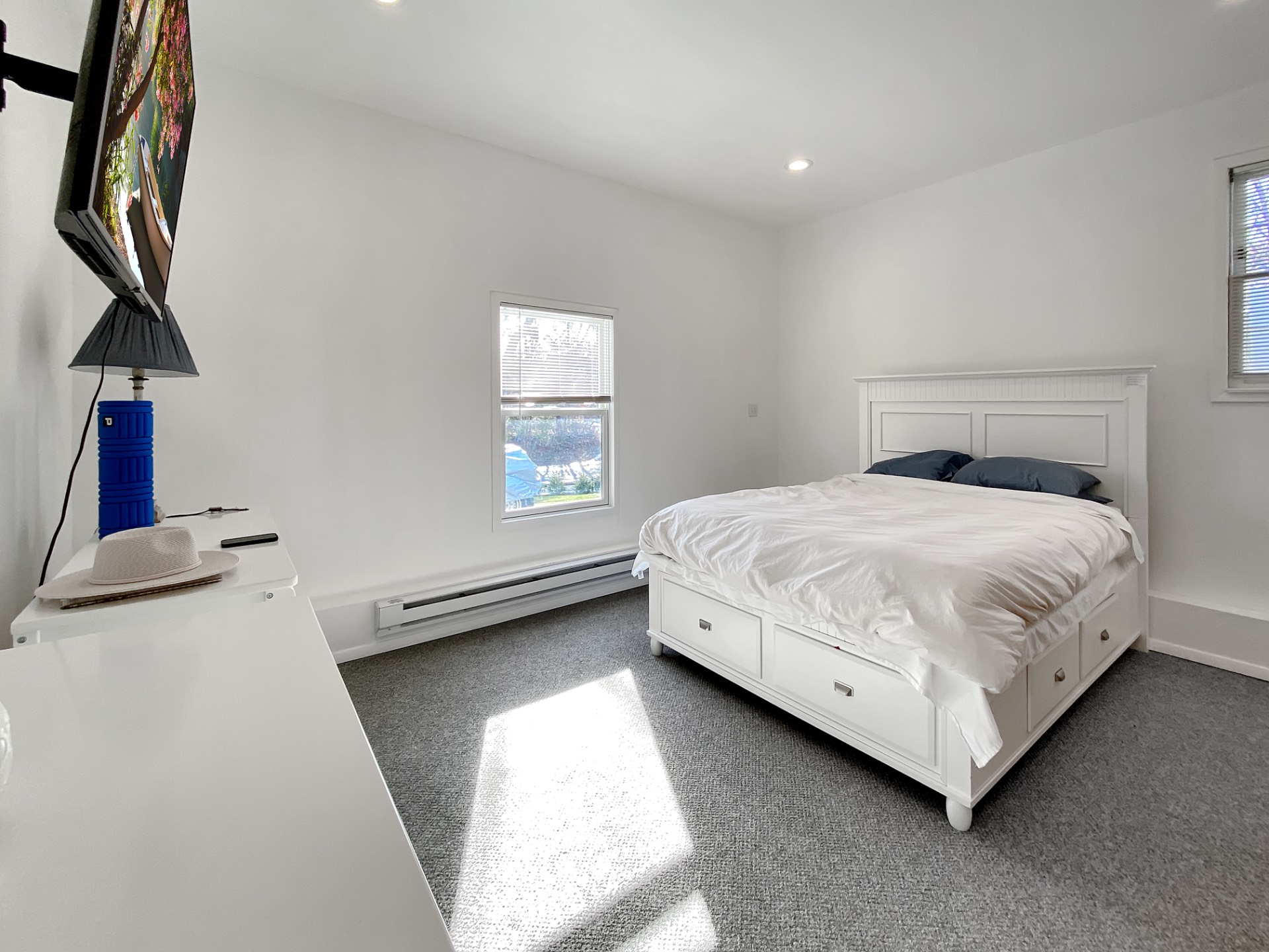 18 Old Riverhead Road East Hampton Bays, NY 11946 - Photo 5 of 15 a bedroom with a bed and a window