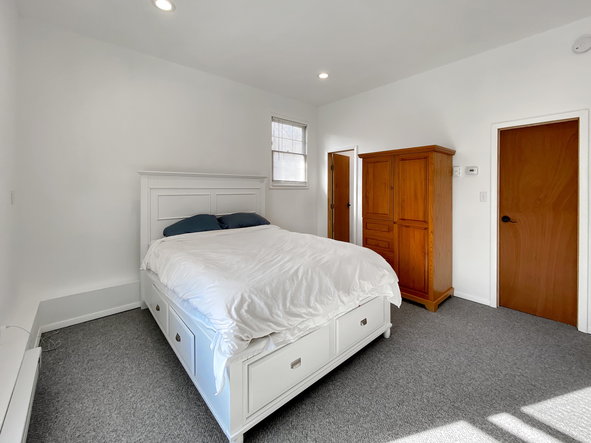 18 Old Riverhead Road East Hampton Bays, NY 11946 - Photo 6 of 15 a bedroom with a bed and dresser