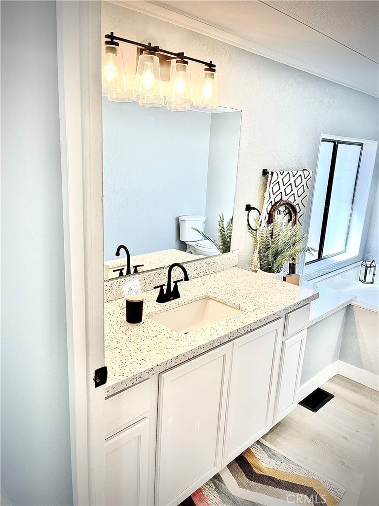 16336 Yuma Road Apple Valley, CA 92307 - Photo 13 of 18 a bathroom with a sink and a mirror