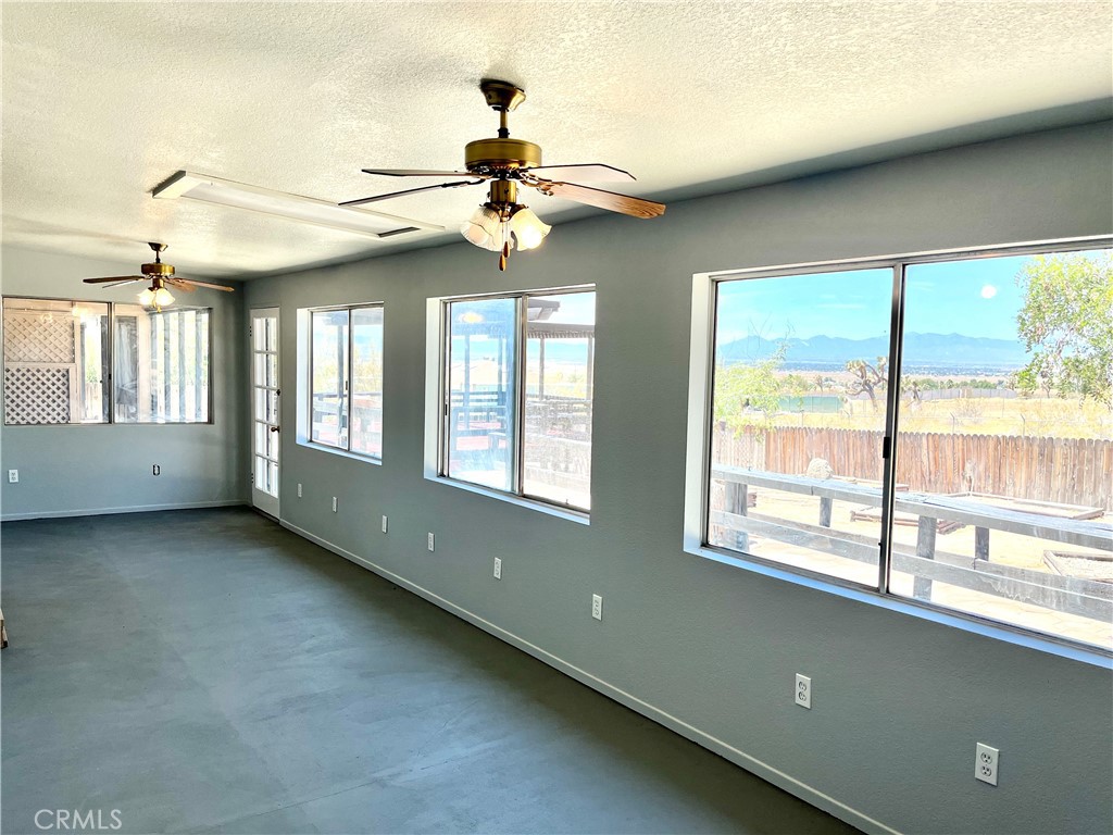 16336 Yuma Road Apple Valley, CA 92307 - Photo 16 of 18 a view of an empty room with a window