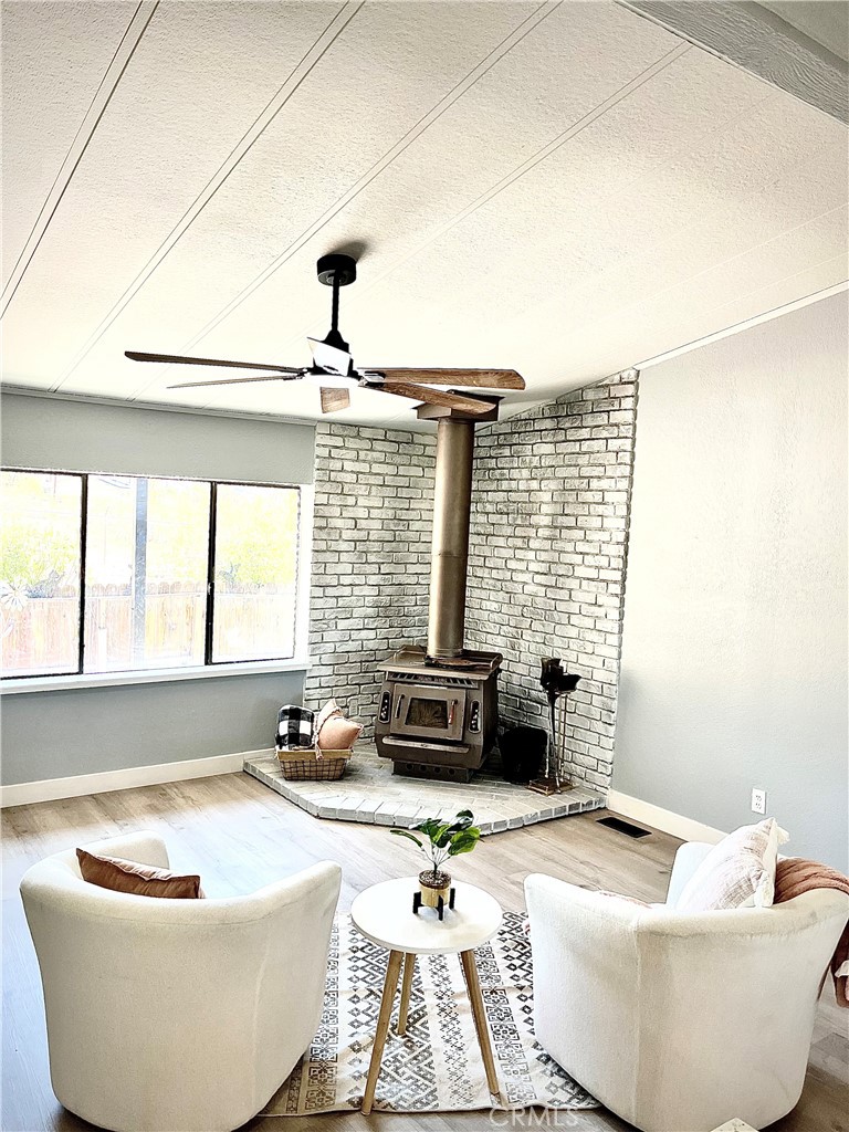 16336 Yuma Road Apple Valley, CA 92307 - Photo 5 of 18 a living room with furniture and a potted plant