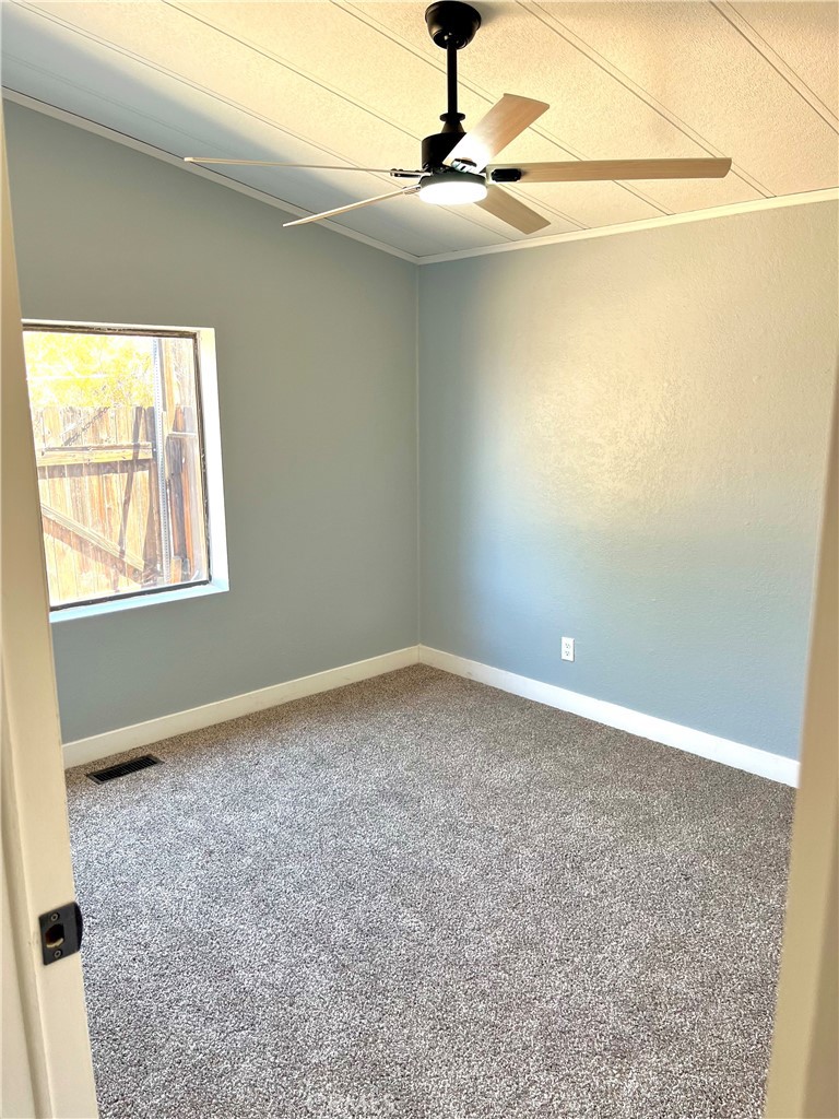 16336 Yuma Road Apple Valley, CA 92307 - Photo 6 of 18 a view of an empty room with a window