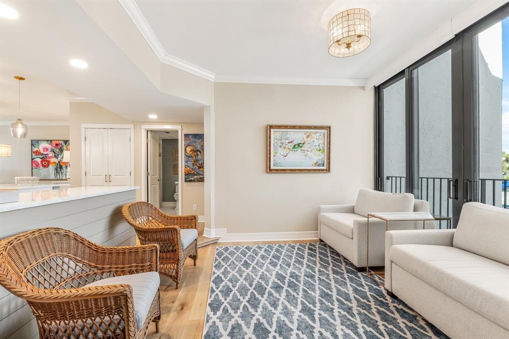 5000 Gasparilla Road, Unit 29A Boca Grande, FL 33921 - Photo 12 of 40 a living room with furniture and a window