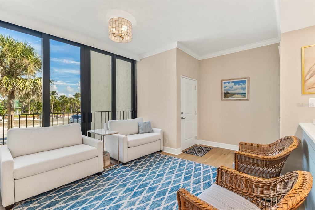 5000 Gasparilla Road, Unit 29A Boca Grande, FL 33921 - Photo 13 of 40 a living room with furniture and a window