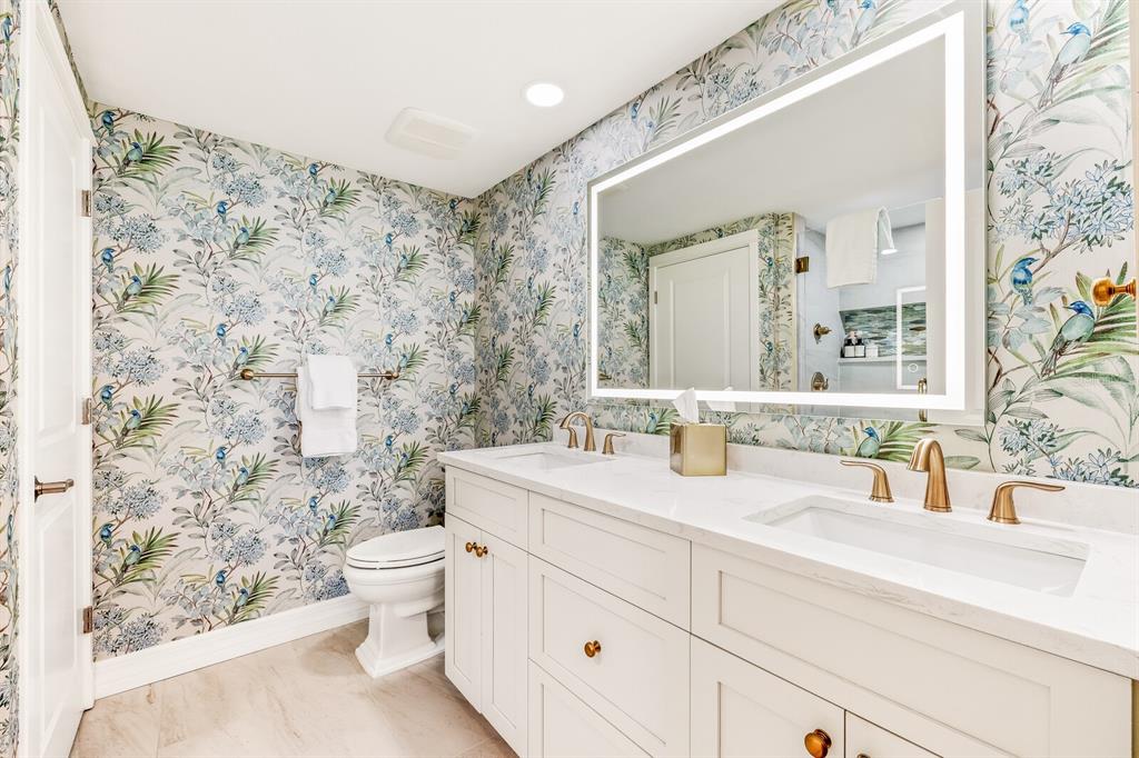 5000 Gasparilla Road, Unit 29A Boca Grande, FL 33921 - Photo 16 of 40 a bathroom with a sink toilet and shower