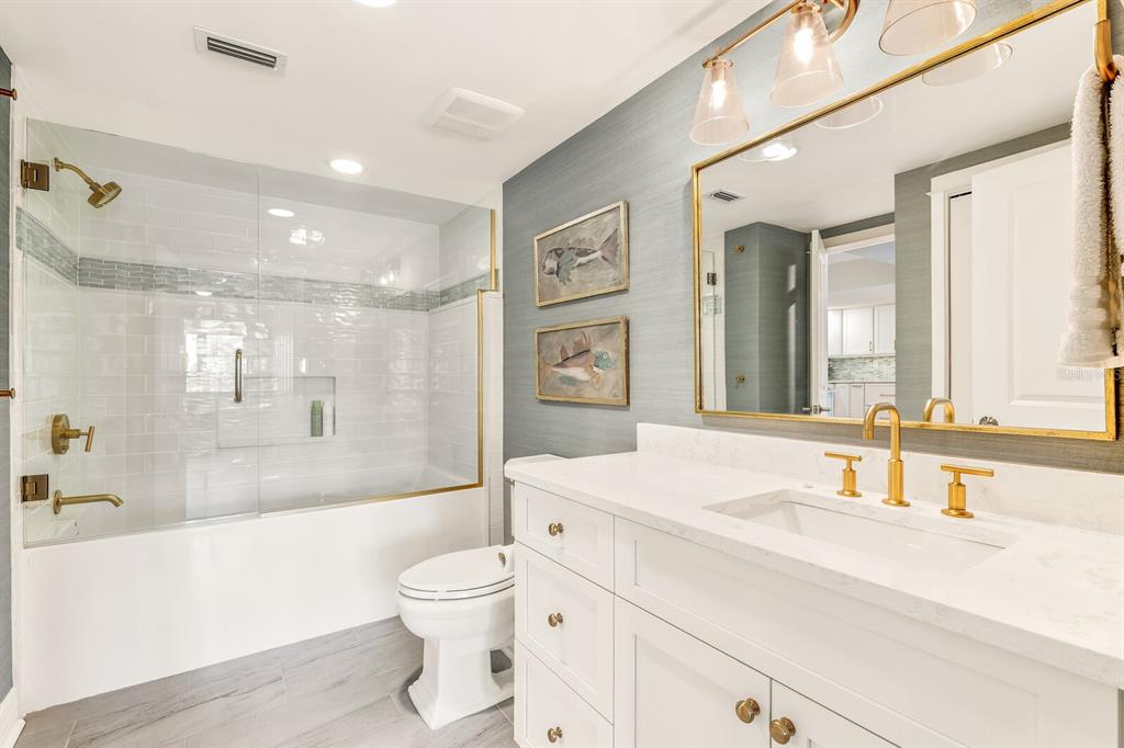 5000 Gasparilla Road, Unit 29A Boca Grande, FL 33921 - Photo 18 of 40 a bathroom with a sink a toilet and a bathtub