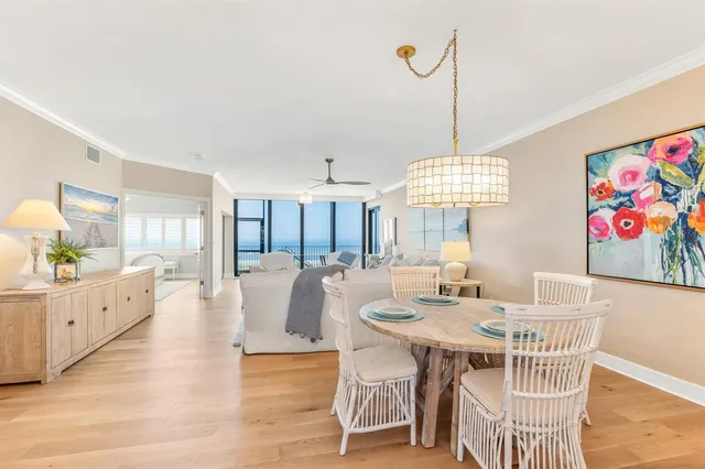 a living room with fireplace furniture and a table