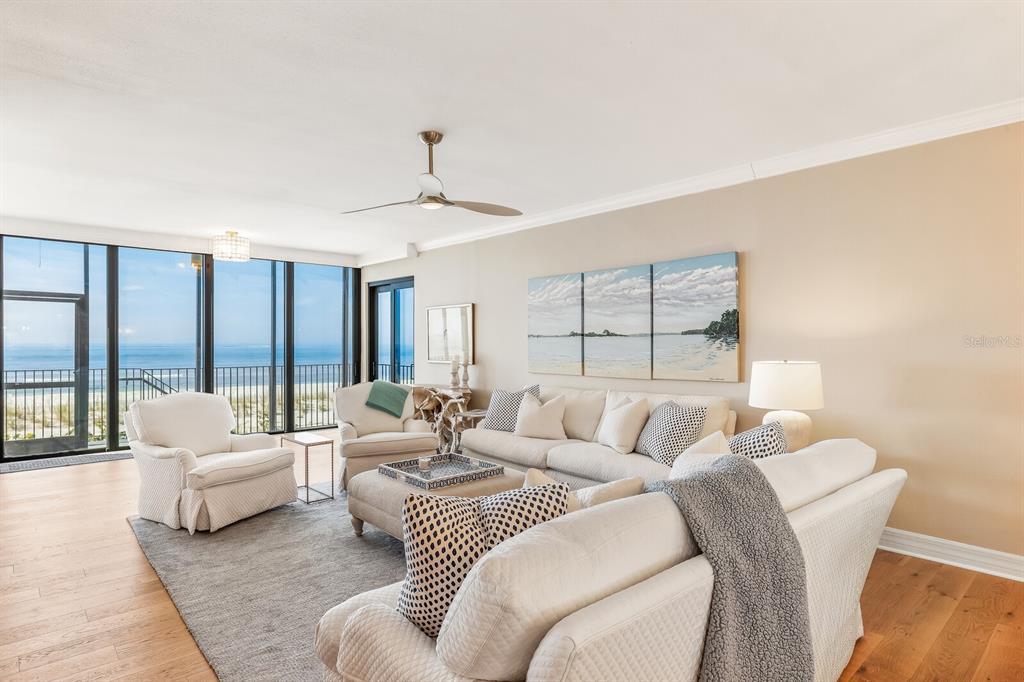 5000 Gasparilla Road, Unit 29A Boca Grande, FL 33921 - Photo 6 of 40 a living room with furniture and a large window
