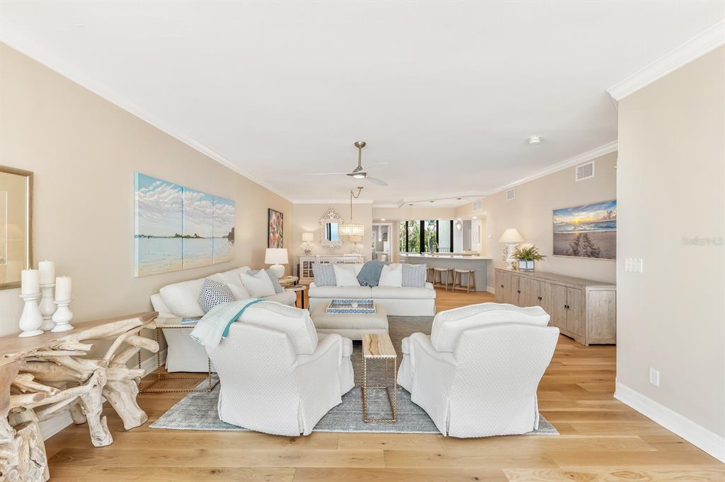 5000 Gasparilla Road, Unit 29A Boca Grande, FL 33921 - Photo 7 of 40 a living room with fireplace furniture and a table