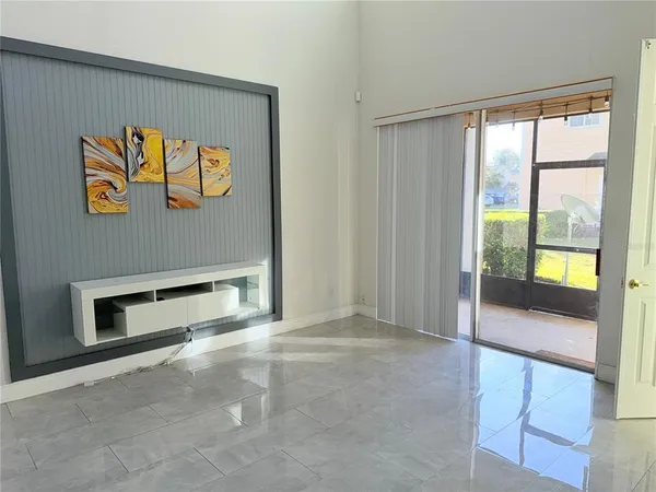 a bathroom with a granite countertop bathtub shower sink vanity and toilet