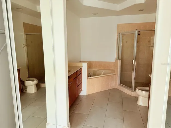 a view of hallway with wooden floor