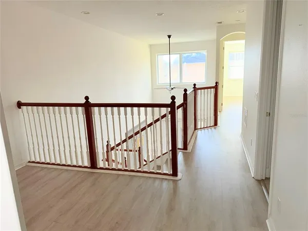 a view of an empty room and a window