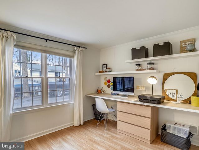 a work place with a couch and a window