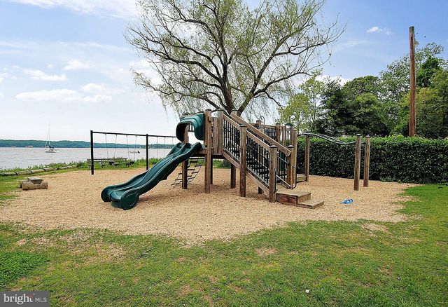 a view of a slide with sitting area