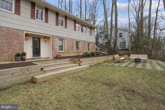 a view of pool with brick walls