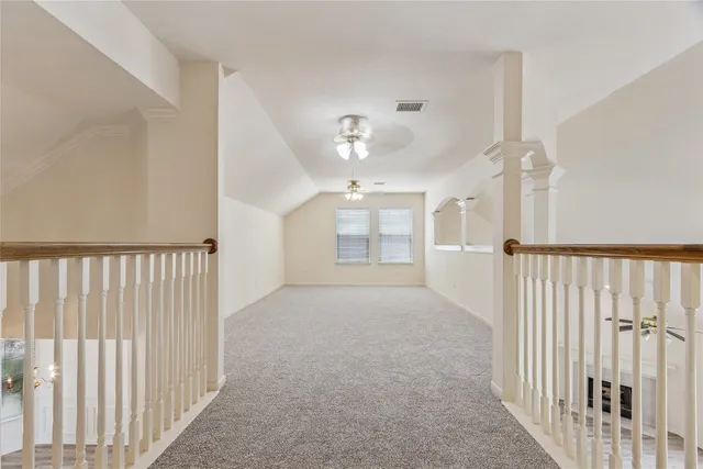 a view of a hallway with a chandelier