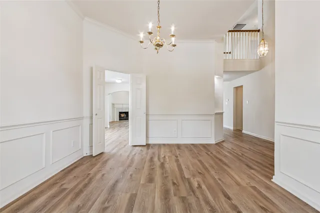 a view of a room with wooden floor and staircase