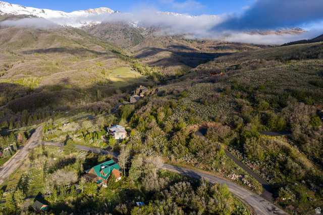 6975 North Durfee Way, Unit 20 Eden, UT 84310 - Photo 3 of 15 Sweeping aerial perspective highlighting extensive mountainous terrain with snow-capped peaks