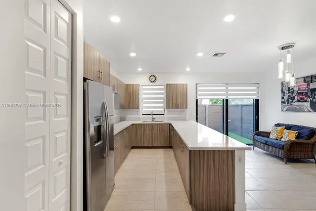 a room with furniture and a potted plant
