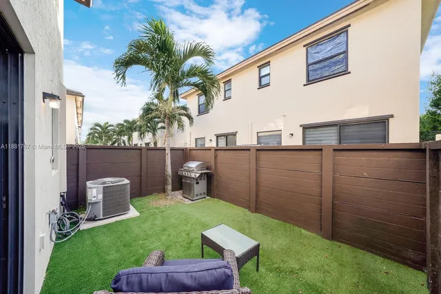 a view of a backyard with plants