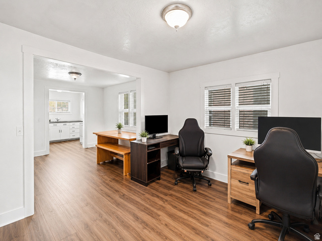 69 South Main Street Manti, UT 84642 - Photo 20 of 44 Spacious room featuring wood-finish flooring and white walls