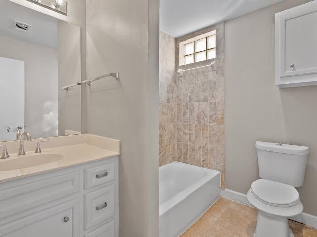 8705 Bryam Street, Unit 801 Houston, TX 77061 - Photo 11 of 16 a bathroom with a sink a toilet and shower