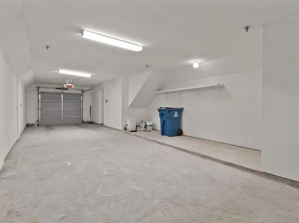 a view of empty room with wooden cabinet