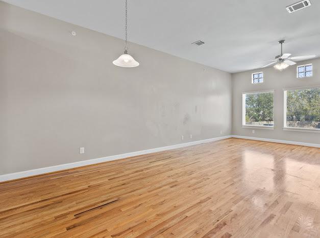 8705 Bryam Street, Unit 801 Houston, TX 77061 - Photo 2 of 16 wooden floor in an empty room with a window