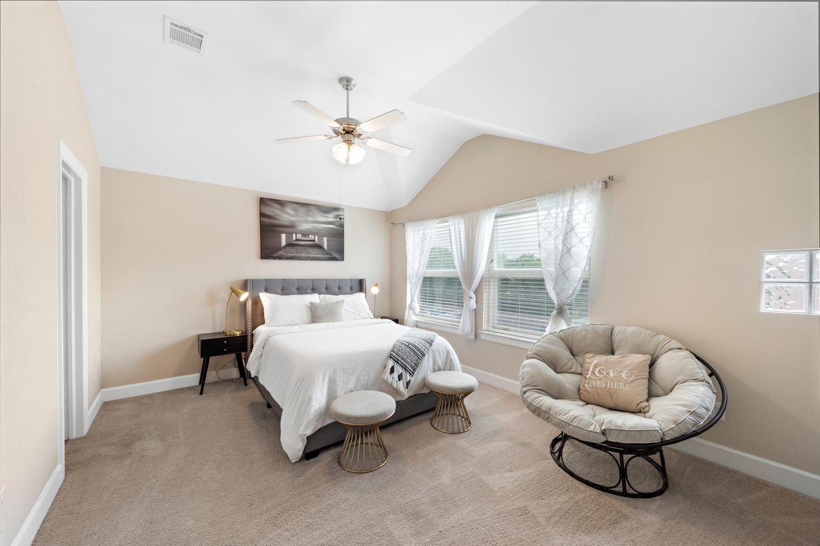 8705 Bryam Street, Unit 801 Houston, TX 77061 - Photo 7 of 16 a spacious bedroom with a bed and ceiling fan