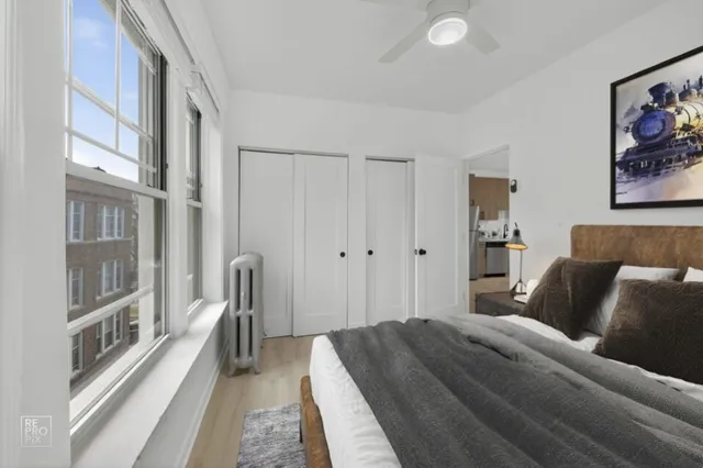 a bedroom with a bed and a walk in closet