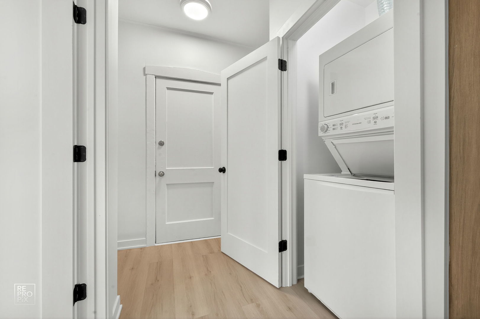 6975 North Bell Avenue, Unit 1 Chicago, IL 60645 - Photo 15 of 16 a view of a hallway with closet and wooden floor