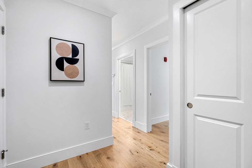 30 Polk Street, Unit 208 Boston, MA 02129 - Photo 16 of 30 a bathroom with a window and a shower