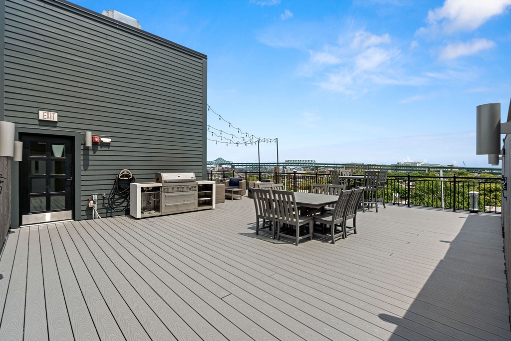 30 Polk Street, Unit 208 Boston, MA 02129 - Photo 18 of 30 a view of a terrace with chairs